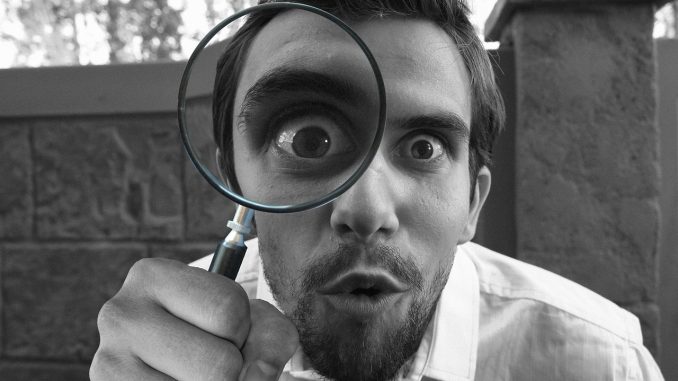 magnifying-4340698_1280 Image of researcher with magnifying glass.